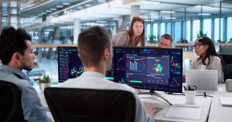 Diverse,Team,Of,Stock,Brokers,Analyzing,Market,Trends,Together
